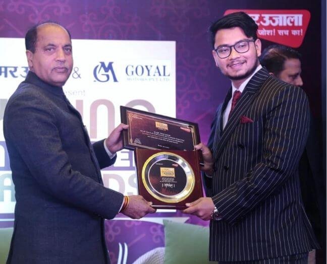 Vishal Saklani receiving an award at a recognition ceremony