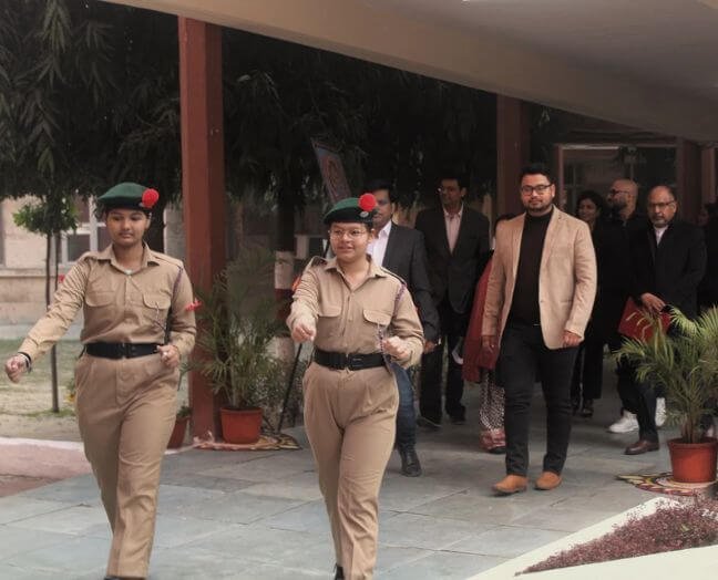 Vishal Saklani visiting an event with organisers and uniformed cadets